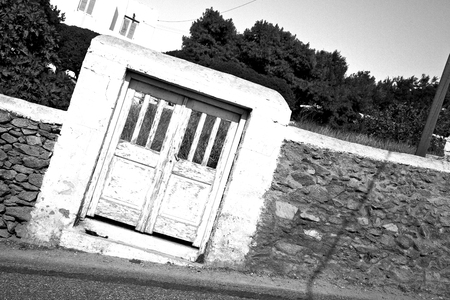 blue door      in antique village santorini greece europe   and white wallの写真素材