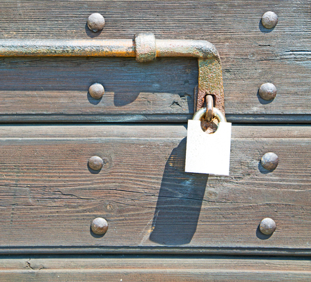 europe old in  italy  antique close brown door and rusty lock  closeup