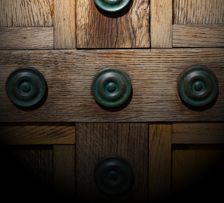 in london antique brown door  rusty  brass nail and lightの写真素材