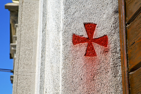 cross sumirago lombardy italy  varese abstract   wall of a curch broke brike pattern sunny day  and skyの写真素材