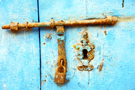 morocco in africa the old wood  facade home and rusty safe padlockの写真素材
