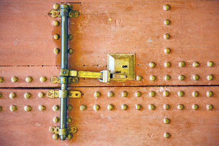brown    morocco in    africa the old wood  facade home and rusty safe padlockの写真素材