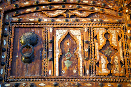 metal grey       morocco in    africa the old wood  facade home and rusty safe padlockの写真素材