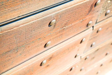 abstract texture of a brown antique wooden old door in italy   europeの写真素材