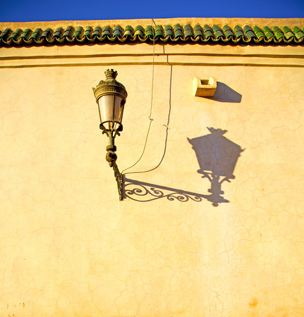 street lamp old construction in africa morocco and  leather near the towerの写真素材