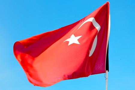 waving flag in the blue sky  tunisia     colour and wave