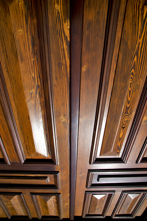 sumirago  abstract   rusty brass brown knocker in a  door curch  closed wood lombardy italy  vareseの写真素材