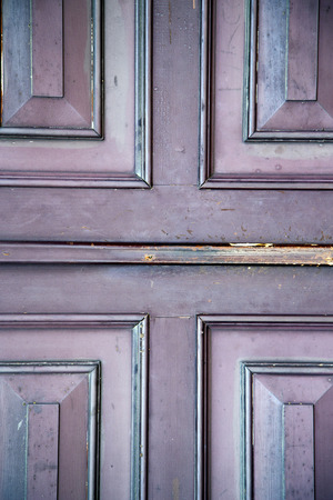 abstract samarate   rusty brass brown knocker in a  door curch  closed wood lombardy italy  vareseの写真素材