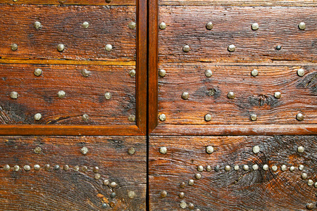 italy  patch lombardy    cross castellanza blur   abstract   rusty brass brown knocker in a  door...