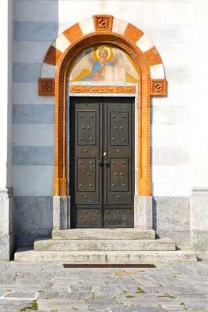 door   in italy  lombardy   column  the milano old   church   closed brick  pavementの写真素材