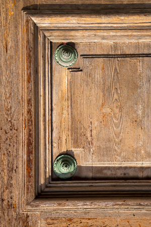 abstract   rusty brass brown knocker in a  door curch  closed wood lombardy italy  varese lonate pozzoloの写真素材