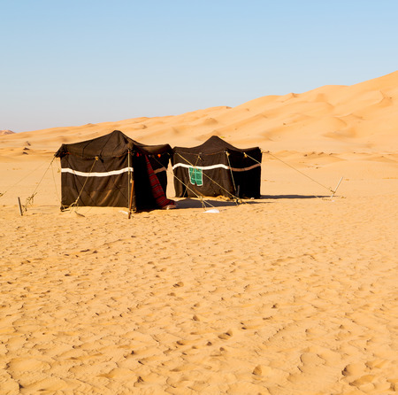 empty quarter and nomad tent of berber people in oman the old desertの写真素材