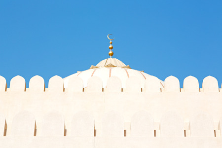 minaret and religion in clear sky in oman muscat the old mosqueの写真素材