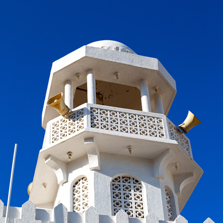 minaret and religion in clear sky in oman muscat the old mosqueの写真素材