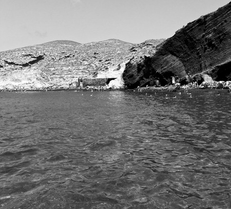 in europe greece santorini island hill and rocks on the summertime beachの写真素材