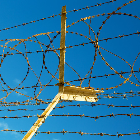 and cloudy sky in oman barbwire in the background