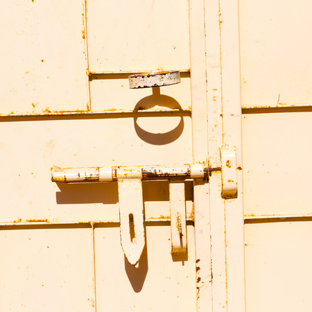in oman the old door metal texture backgroundの写真素材