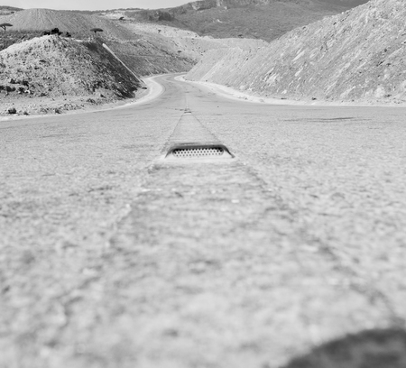 hite line and mountain panorama in oman asphalt street w