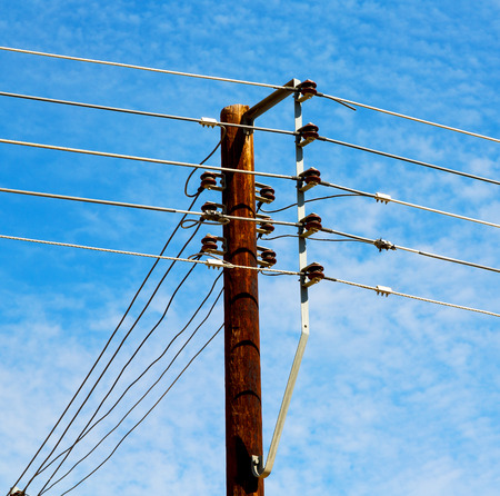 wood pylon energy and current line   in oman the electric cable