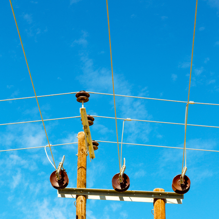 wood pylon energy and current line   in oman the electric cable