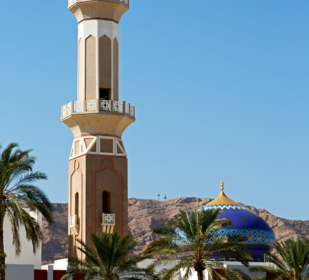 minaret and religion in clear sky in oman muscat the old mosqueの写真素材