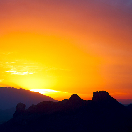 the blurred  sun falling down arabian mountain  in   omanの写真素材