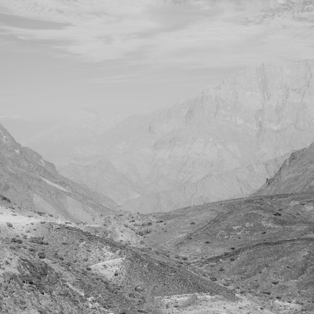  gorge and canyon the deep cloudy sky   in oman the old  mountain の写真素材