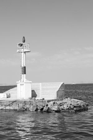 lighthouse  in the mediterranean sea cruise greece island in santorini europe boat harbor and pierの写真素材