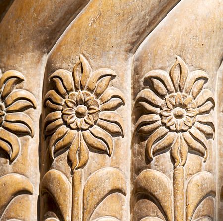 in old iran mousque the column  incision of a flower like abstract background