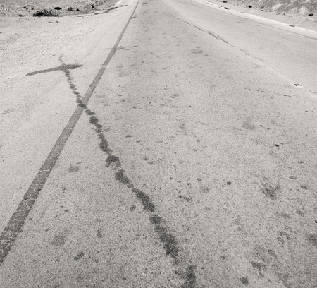 hite line and mountain panorama in oman asphalt street w