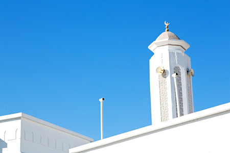 minaret and religion in clear sky in oman muscat the old mosqueの写真素材
