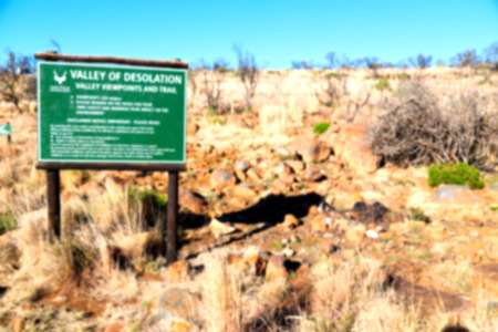 blur   in south africa valley of desolation dirty road rock tree and skyの写真素材