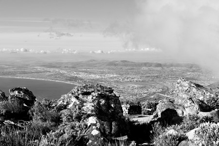 blur  in south africa cape town  city skyline from table mountain sky ocean and houseの写真素材