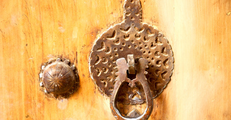 in iran antique door entrance and      decorative handle for background