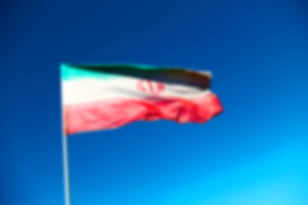 in iran blur  iranian waving flag  the blue sky and windの写真素材