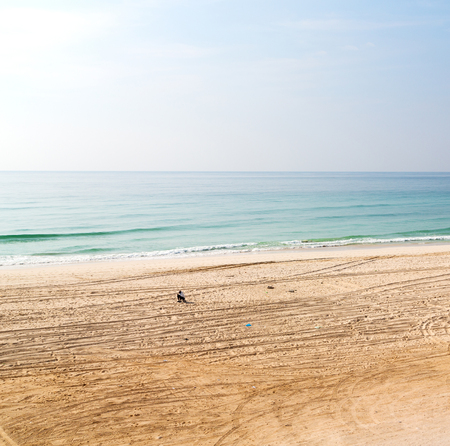 near sandy beach sky     and mountain in oman arabic sea  の写真素材