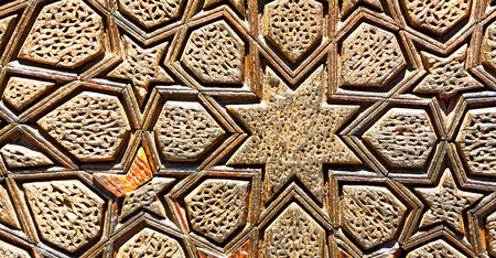 blur in iran the old decorative flower tiles from antique mosque like backgroundの写真素材
