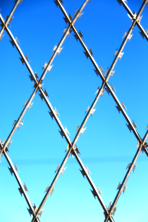 abstract razor wire in the clear sky like background textureの写真素材