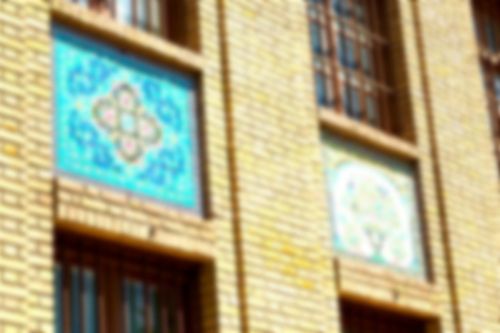 blur in iran the old decorative flower tiles from antique mosque like backgroundの写真素材