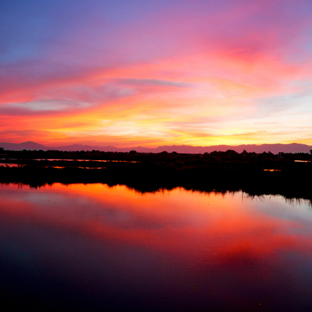  view from water  of the sunrise full of colors and rain concept of relaxの写真素材
