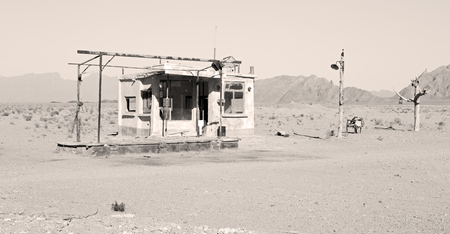in iran old gas station  the desert mountain background and nobodyの写真素材