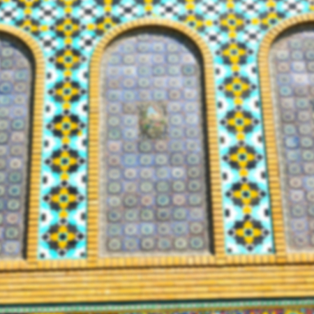 blur in iran the old decorative flower tiles from antique mosque like backgroundの写真素材