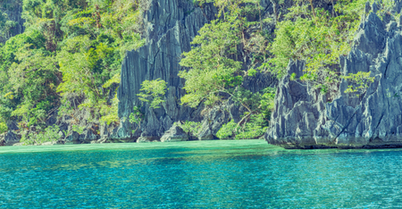 from a boat  in  philippines  snake island near el nido palawan beautiful panorama coastline sea and rockの写真素材