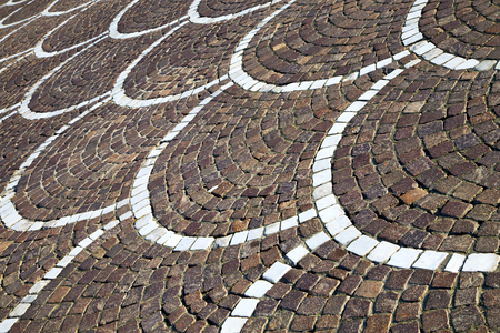 in the castano primo  street lombardy italy  varese abstract   pavement of a curch and marbleの写真素材