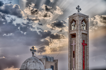 in amman jordan the chatolic church in the light of cloudy sunsetの写真素材