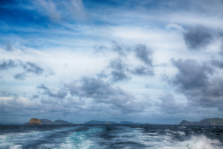 blur  in  philippines   a view from  boat  and the pacific ocean  mountain background