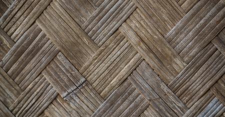a wall build on wicker bamboo like abstract vintage surfaceの写真素材