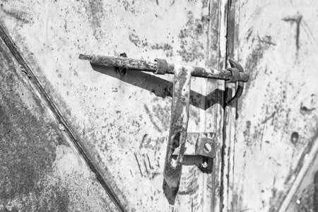 antique metal lock door in a old home concept of safetyの写真素材