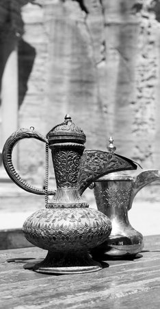 in the site of petra jordan the traditional coffe container isolated on a tableの写真素材