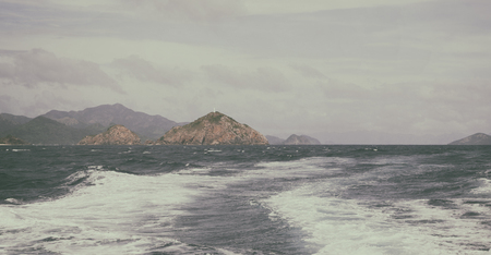 blur  in  philippines   a view from  boat  and the pacific ocean  mountain background